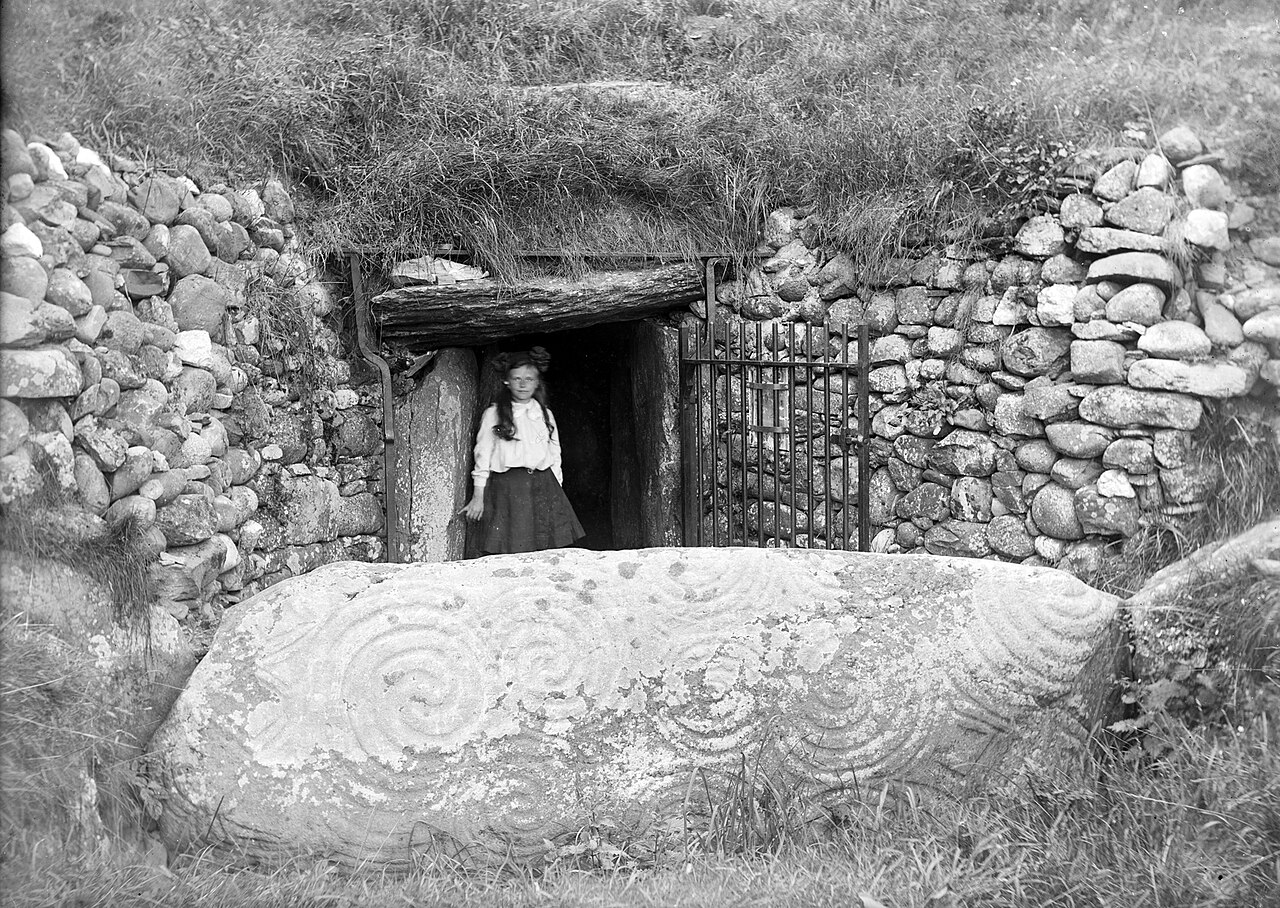 The kerbstone and white quartz facade of Newgrange passage tomb, Ireland, its roof-box aligned to the winter-solstice sunrise